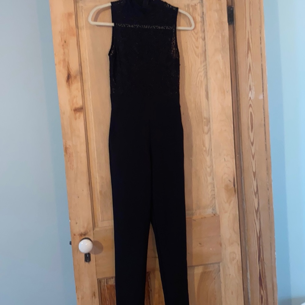 Black strapless jumpsuit, high neck, lace top. Worn once, excellent condition.